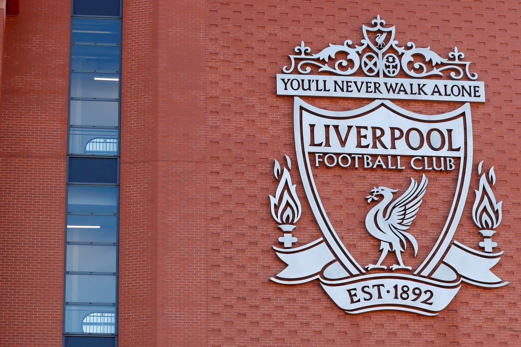 The words “You’ll Never Walk Alone” adorn the Liverpool FC crest on the wall of their Anfield Stadium. Photo: Reuters