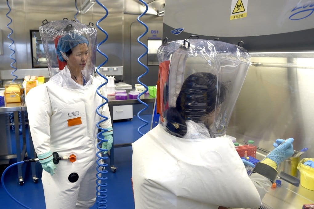 Researchers in a lab at the Wuhan Institute of Virology, which is at the centre of a persistent conspiracy theory about the origin of the new coronavirus. Photo: EPA-EFE