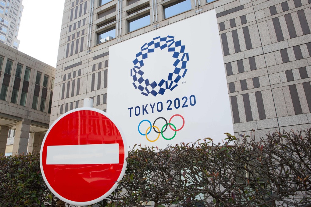 A no entry sign in front of a Tokyo government building with a banner for the 2020 Olympic Games. Photo: SOPA Images