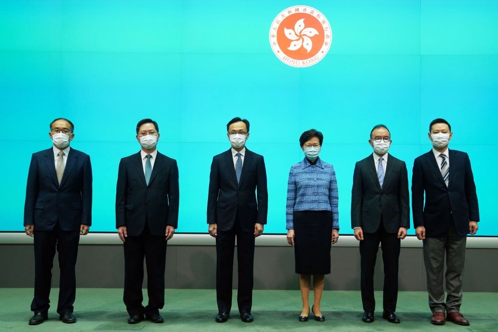 Carrie Lam with her newly appointed secretaries: (from left) Christopher Hui, Alfred Sit, Patrick Nip, Erick Tsang and Caspar Tsui. Photo: Sam Tsang