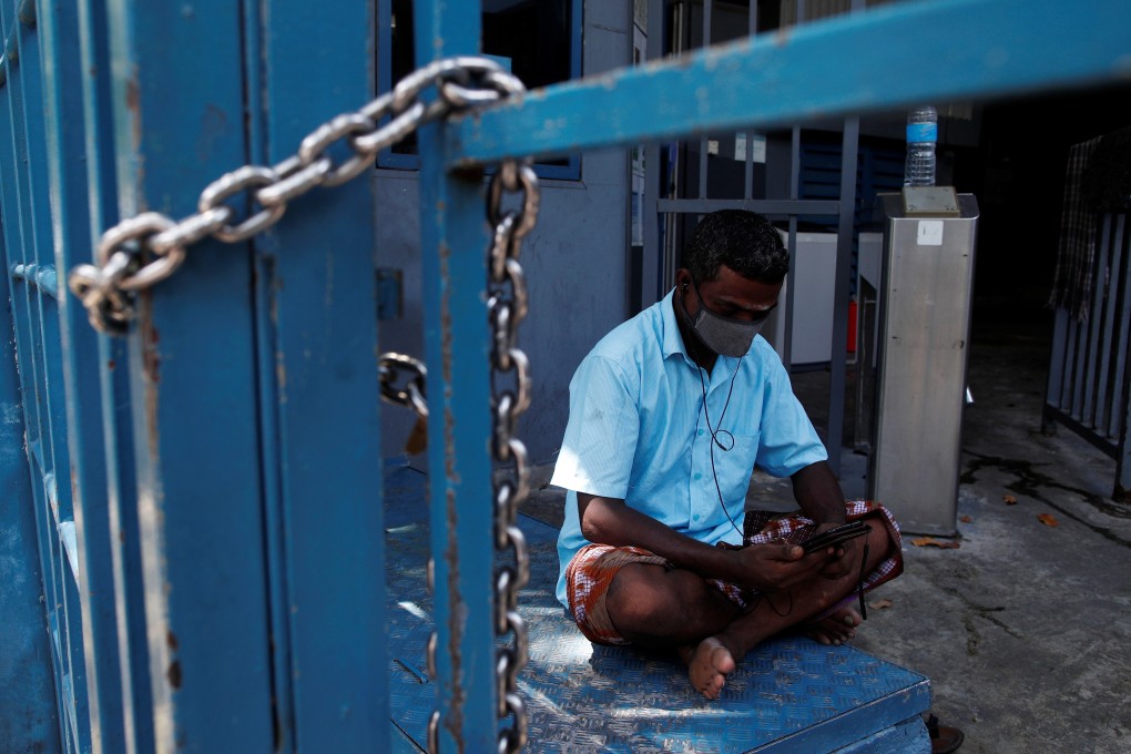 A migrant worker pictured in a dormitory under lockdown in Singapore on Wednesday. Photo: Reuters