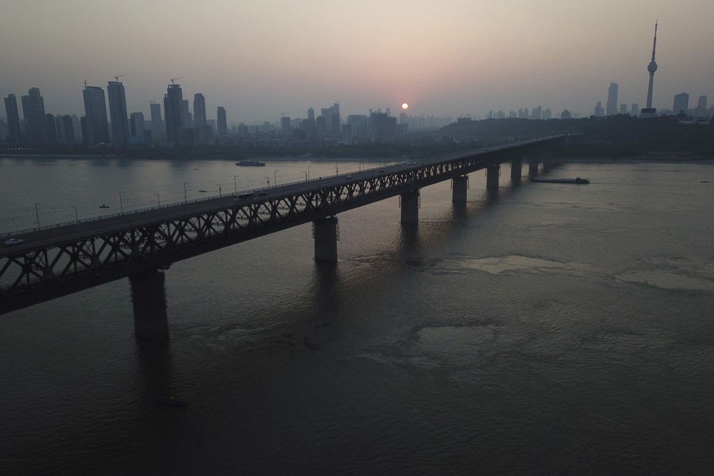 The sun sets behind the Wuhan Yangtze River Bridge. The Wuhan government and China’s Ministry of Emergency Management were targeted by Vietnamese hackers, a US cybersecurity firm says. Photo: AP