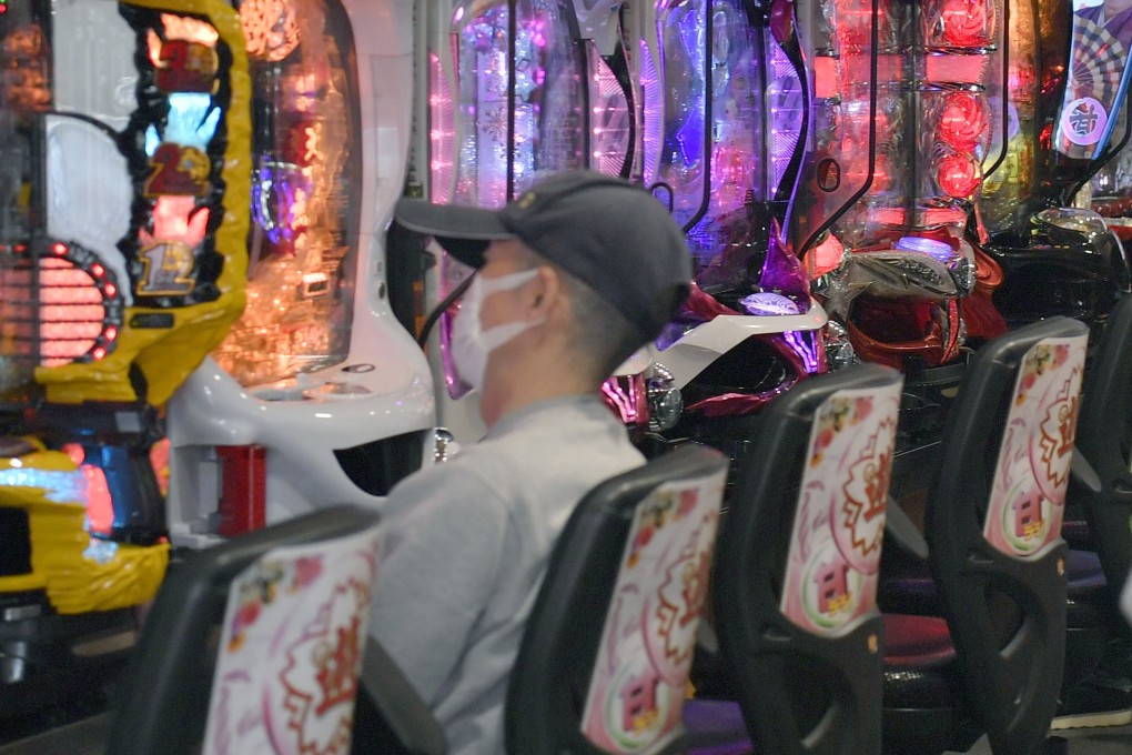 A man wearing a face mask at a pachinko parlour in Osaka. Photo: Kyodo