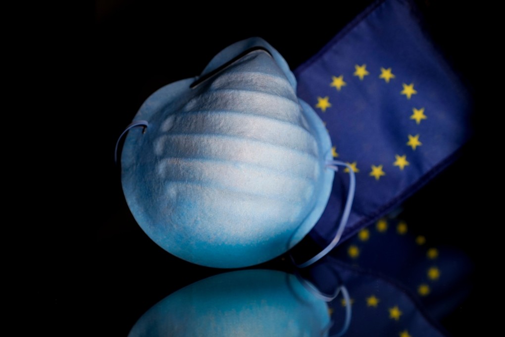 An illustration photo taken on February 27, 2020 in Brussels shows a protective face mask displayed to a European flag. Photo: AFP