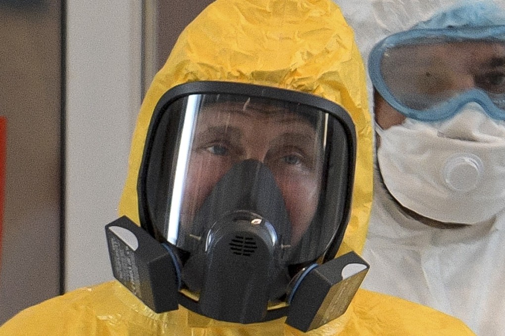 Russian President Vladimir Putin, wearing a protective suit, visits a hospital for coronavirus patients in Kommunarka, outside Moscow. Photo: AP