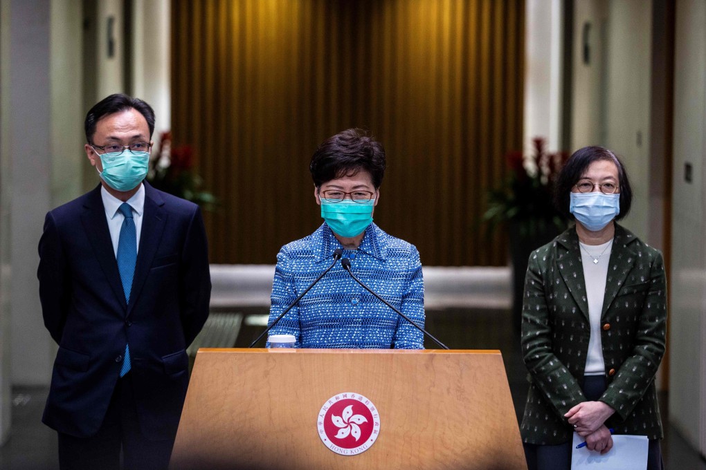 Hong Kong Chief Executive Carrie Lam (centre) attends a press briefing on March 3 with Patrick Nip, then secretary for Constitutional and Mainland Affairs, and the Secretary for Food and Health, Sophia Chan. Nip will now take over the civil service portfolio. Photo: AFP