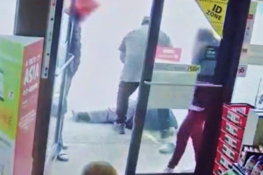 The suspect in a racist attack on an elderly Asian man stands over his victim outside a Vancouver convenience store on March 13, in a video released on Wednesday by Vancouver police. Photo: Handout