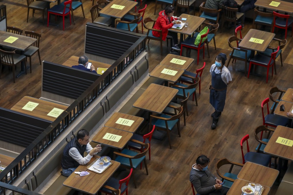 Tables and chairs taped for social distancing measures at a restaurant in Admiralty, Hong Kong. Photo: Nora Tam