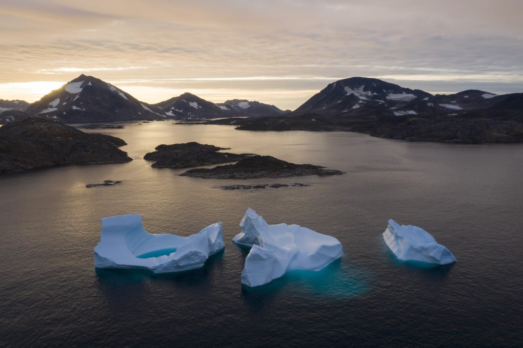 Large icebergs float away as the sun rises near Kulusuk, Greenland in August 2019. Photo: AP