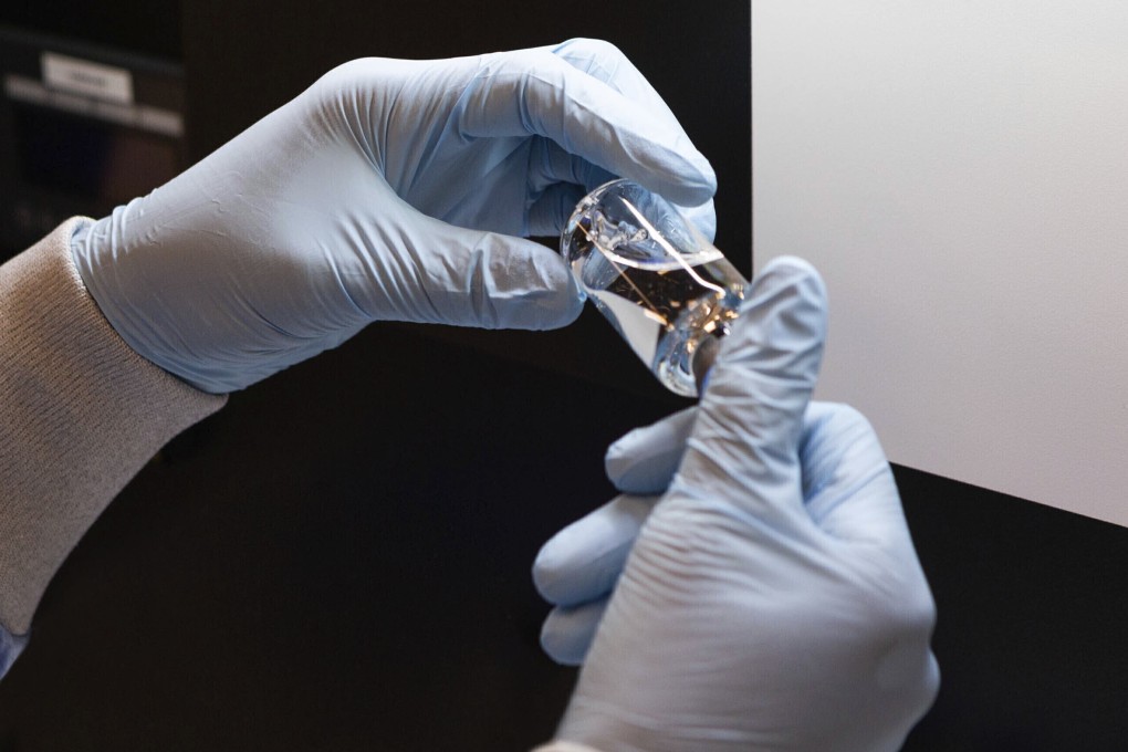 A vial of remdesivir is visually inspected at a Gilead manufacturing site in the US in March. Photo: Gilead Sciences via AP