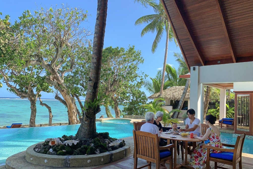The Lau family from Hong Kong at their villa in Fiji, where they have been stranded by the cancellation of international flights amid the coronavirus pandemic. They spend their days snorkelling, kayaking and fishing as they wait to continue their year-long round-the-world journey.