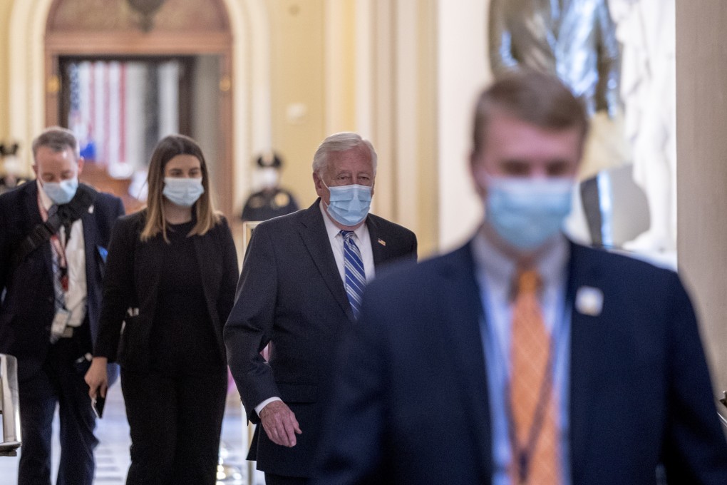 House Majority Leader Steny Hoyer, second from right, walks off of the House floor on Capitol Hill on Thursday. Photo: AP