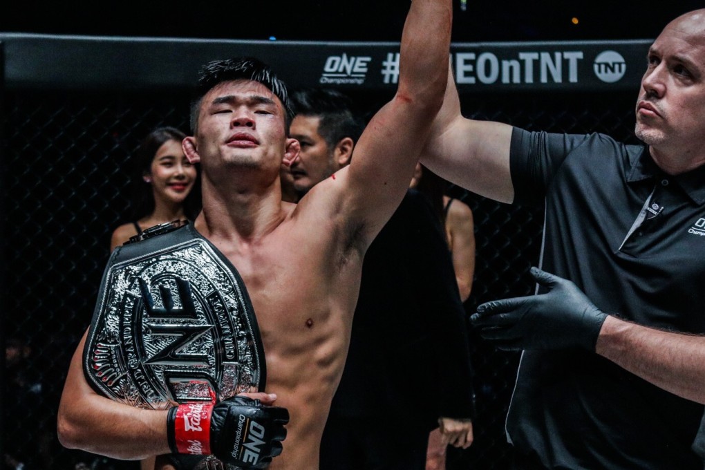 Referee Olivier Coste raises Christian Lee’s arm at ONE: Century in Tokyo. Photos: ONE Championship