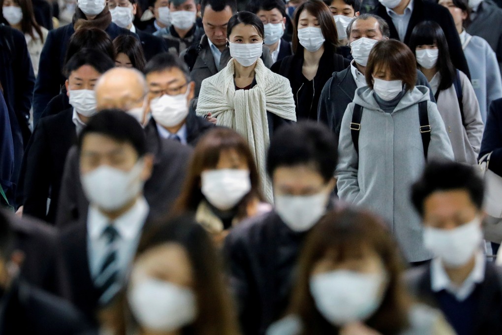 Half our face is hidden when we put a mask on – how does the loss of seeing a smile or frown affect the way we interact with each other? Photo: Reuters