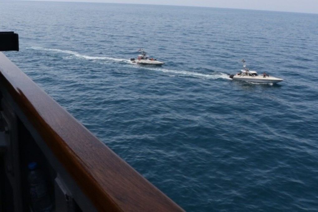 Iranian Islamic Revolutionary Guard Corps Navy (IRGCN) vessels are seen close to the USS Paul Hamilton and other US military ships, crossing the ships’ bows and sterns at close range while operating in international waters of the north Gulf. Photo: AFP