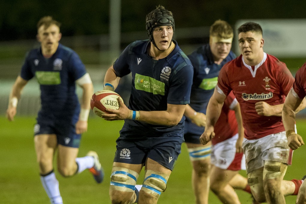 Scotland's Cameron Henderson takes the ball in a record-breaking match against Wales this year. Photo: Craig Watson