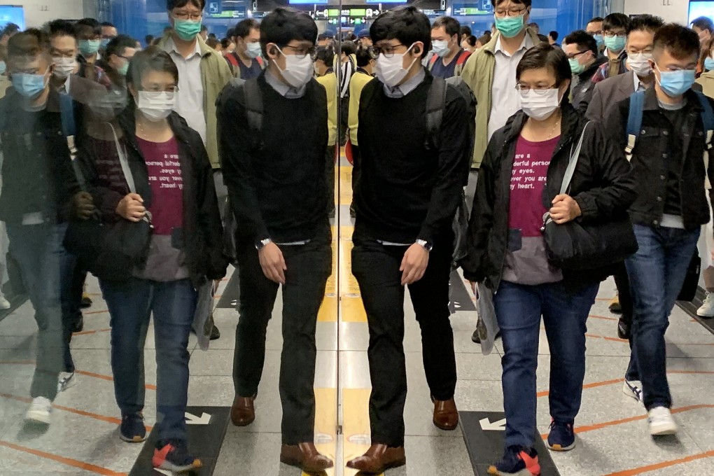 Morning commuters in face masks at Admiralty MTR station. Photo: Dickson Lee