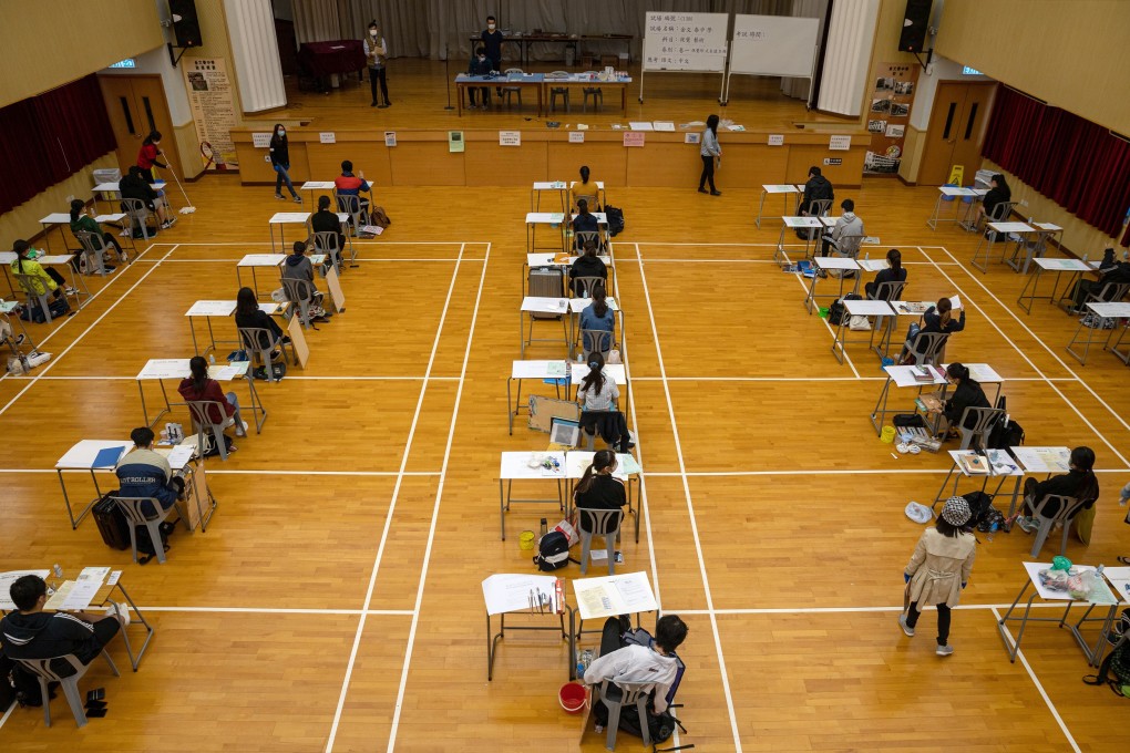 Students sit spaced apart during the Hong Kong Diploma Secondary Education (DSE) visual arts examination at Clementi Secondary School. Photo: Jerome Favre/POOL