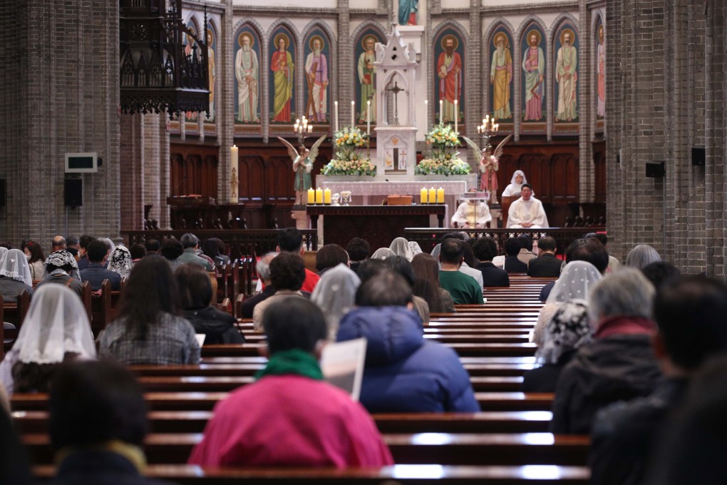 Catholics attend a public mass at Myeongdong Cathedral in central Seoul, South Korea, on Sunday. Photo: EPA