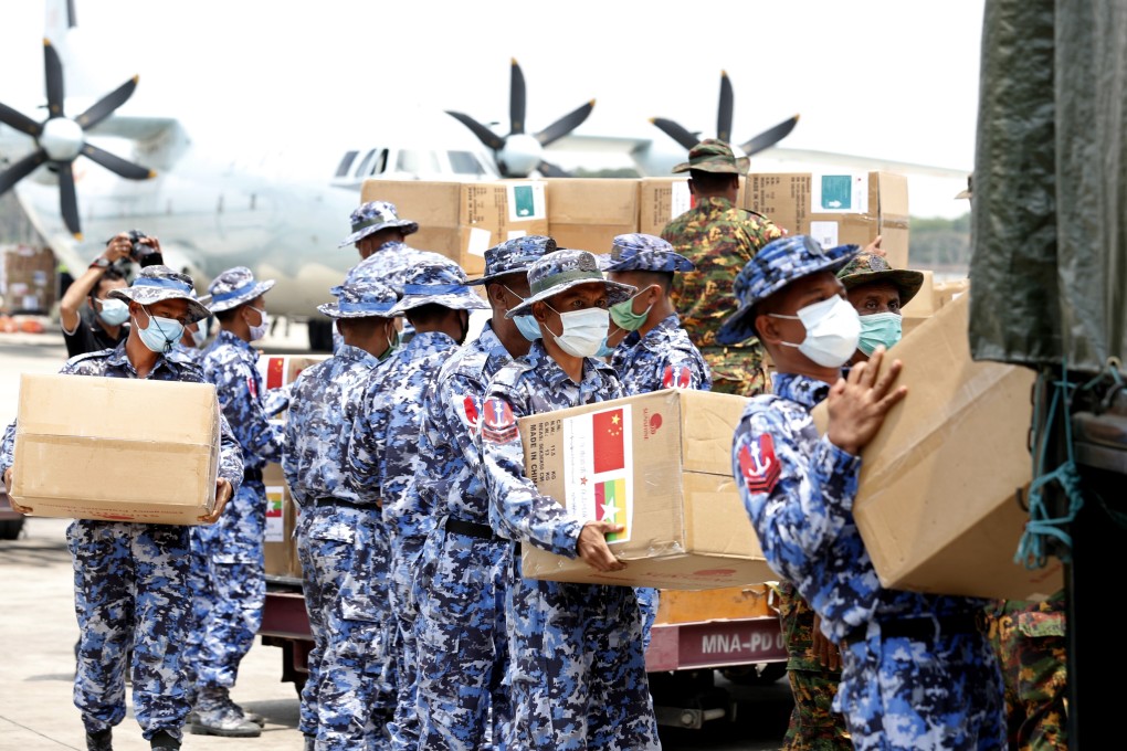 Myanmar soldiers unload medical supplies at Yangon International Airport on Friday. Photo: EPA-EFE
