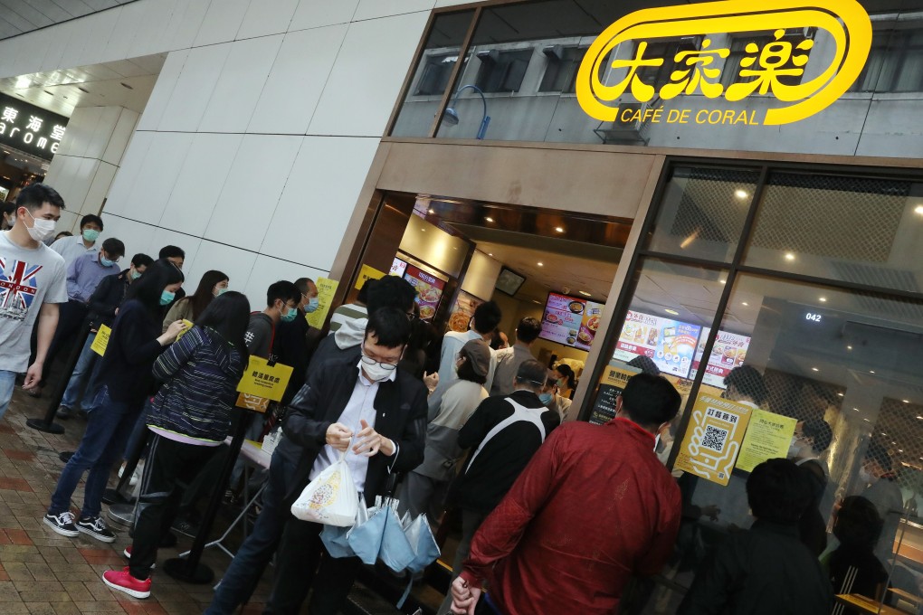 People queuing for lunch at a restaurant in Kwun Tong, Hong Kong, under the new social-distancing law. Restrictions during the coronavirus pandemic have left many businesses nursing deep operating losses. Photo: K. Y. Cheng