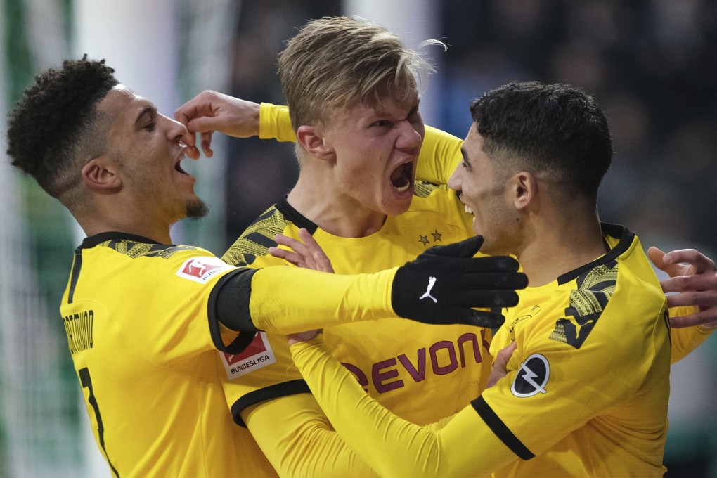 Borussia Dortmund players celebrate scoring a goal against Werder Bremen in the German Bundesliga. The league is set to resume on May 9. Photo: AP