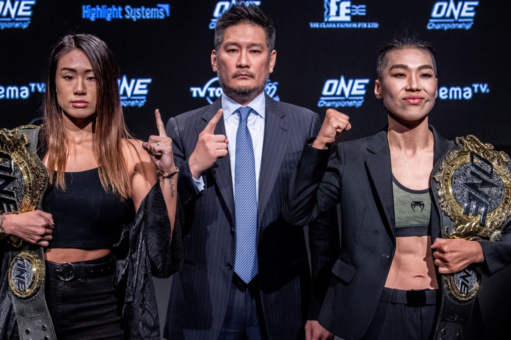 ONE Championship CEO Chatri Sityodtong is flanked by atomweight champion Angela Lee (left) and strawweight champion Xiong Jingnan. Photos: ONE Championship
