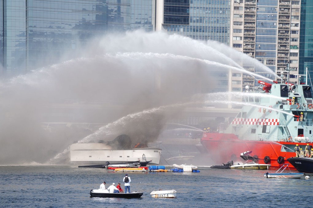 Smoke billowing out of a yacht at the Kwun Tong Typhoon Shelter in Hong Kong. Photo: Sam Tsang