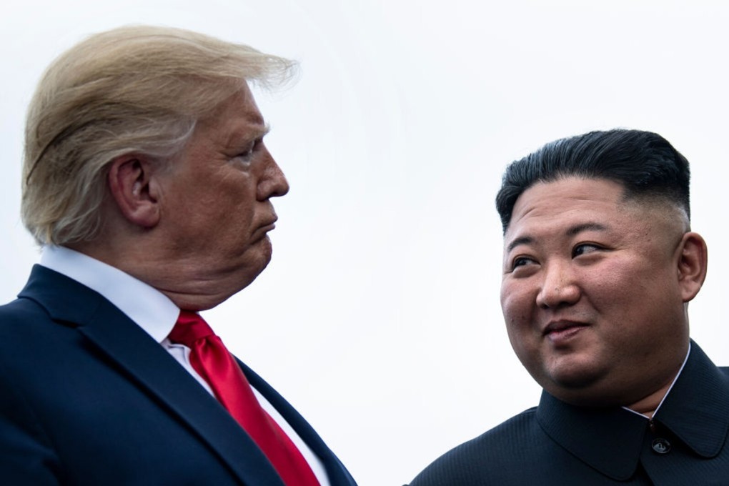 US President Donald Trump and North Korea's leader Kim Jong-un talk before a meeting in the demilitarised zone in June 2019. Photo: TNS