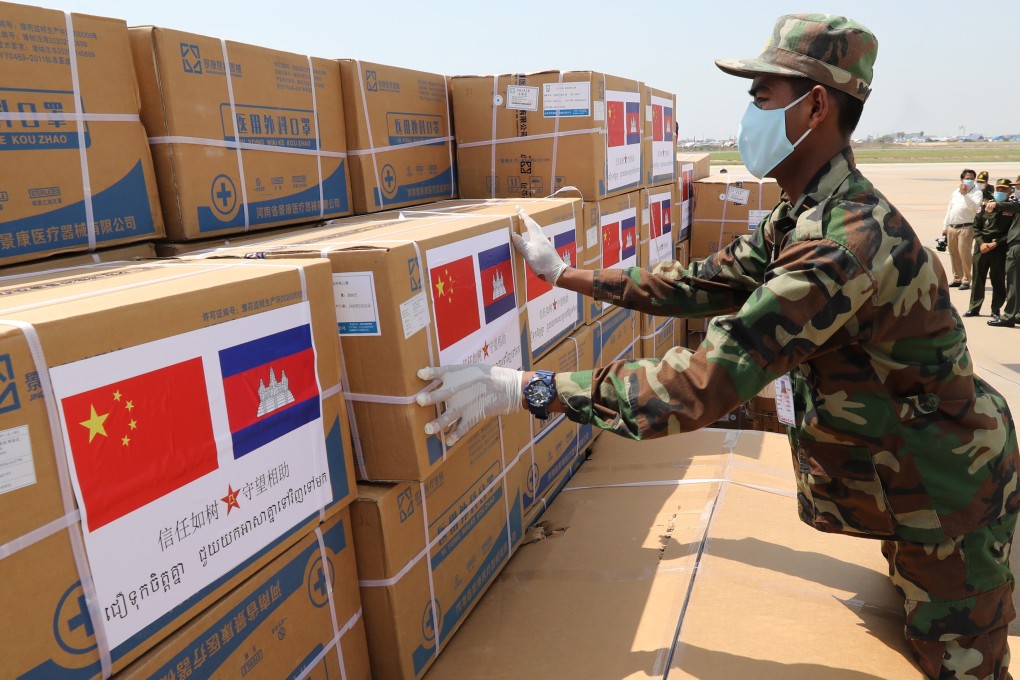 A Cambodian soldier unloads medical supplies donated by China on Saturday at Phnom Penh International Airport. Photo: EPA-EFE