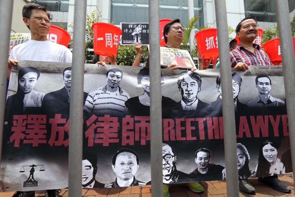 Protesters in Hong Kong march to the central government liaison office in Sai Ying Pung on July 9, 2016, on the first anniversary of the mass arrest of human rights lawyers on the mainland. Photo: Dickson Lee