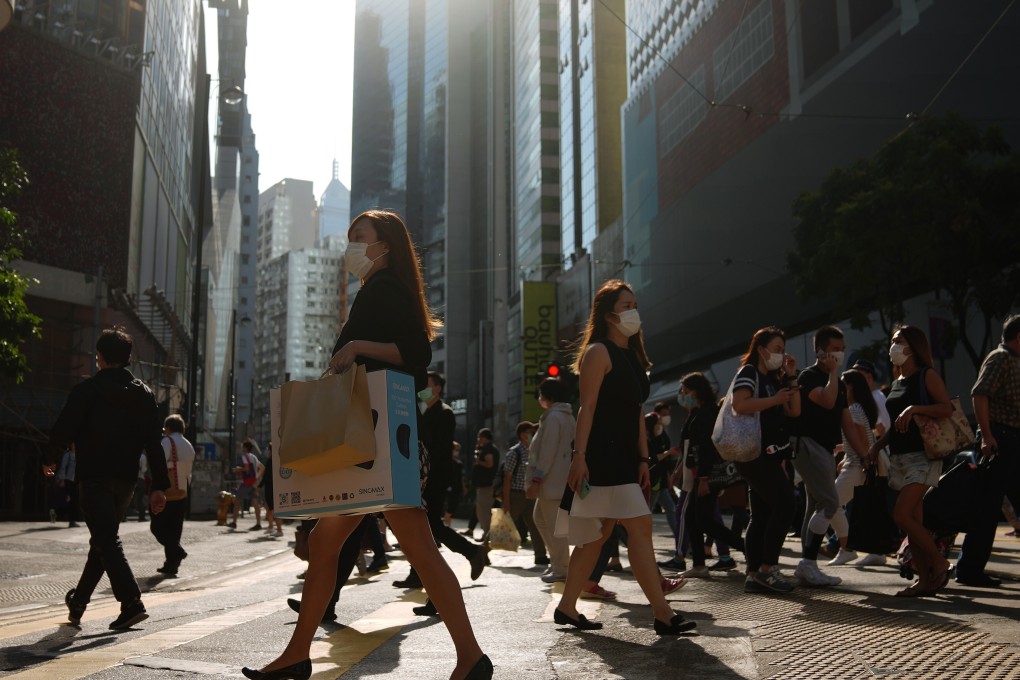 Pedestrians in Hong Kong don surgical masks during the coronavirus crisis. Photo: Sam Tsang