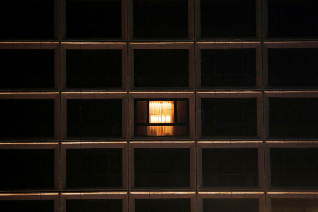 Lights on at one window at a Hong Kong hotel on March 25. The city’s tourism and hospitality sectors have been struggling to cope with the loss of business following the coronavirus outbreak. Photo: Reuters