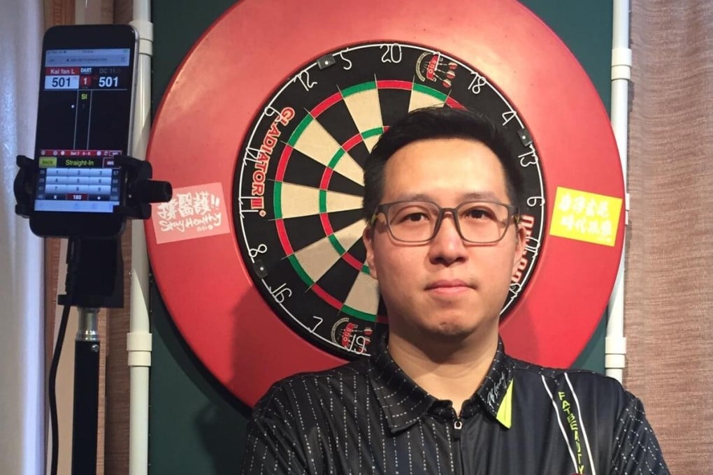 Kevin Leung Kai-fun in front of the dartboard and camera set up he uses in his Jordan flat for the PDC Home Tour series. Photo: Handout