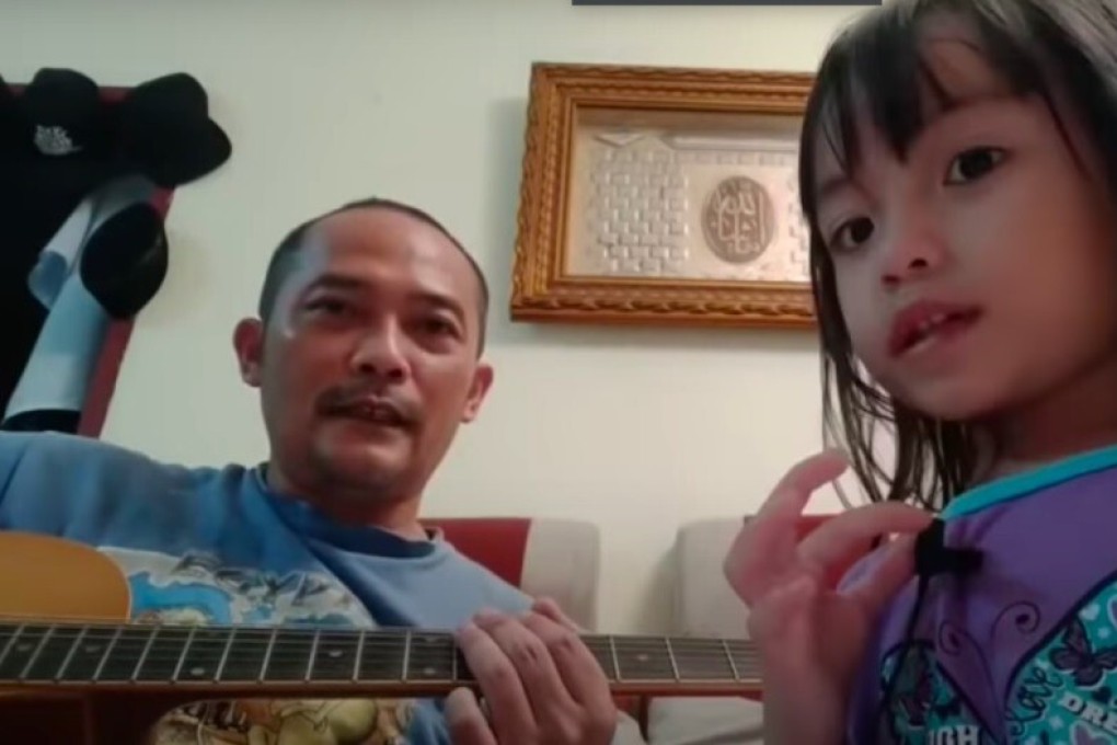 Ujang Ijon and his three-year-old daughter Audrey perform Killing in the Name by US rockers Rage Against the Machine.