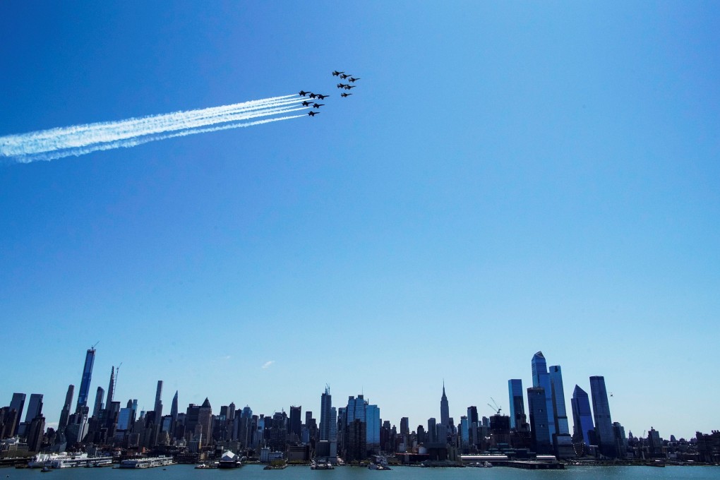US Navy Blue Angels and US Air Force Thunderbirds demonstration perform a flyover in New York to honour first responders and essential workers. Photo: Reuters