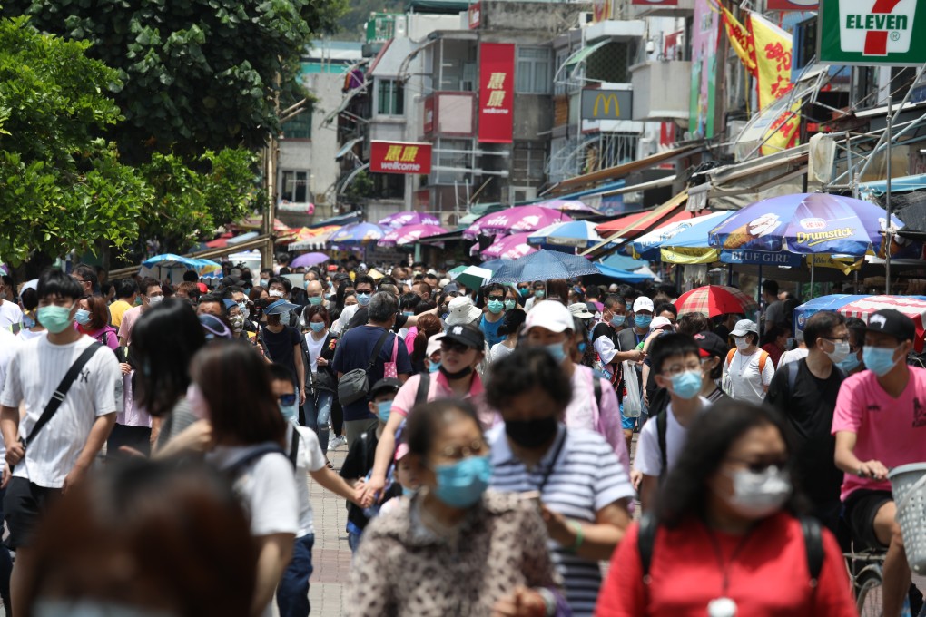 Visitors walk through the streets of Cheung Chau during the bun festival. Photo: Nora Tam