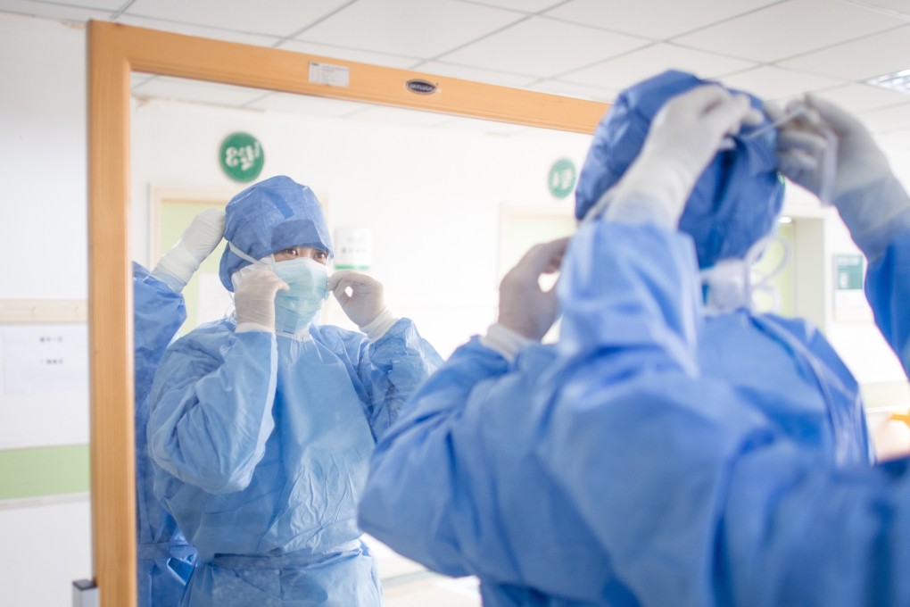 A medical worker prepares to enter the isolation ward at a hospital in Wuhan. Photo: Xinhua