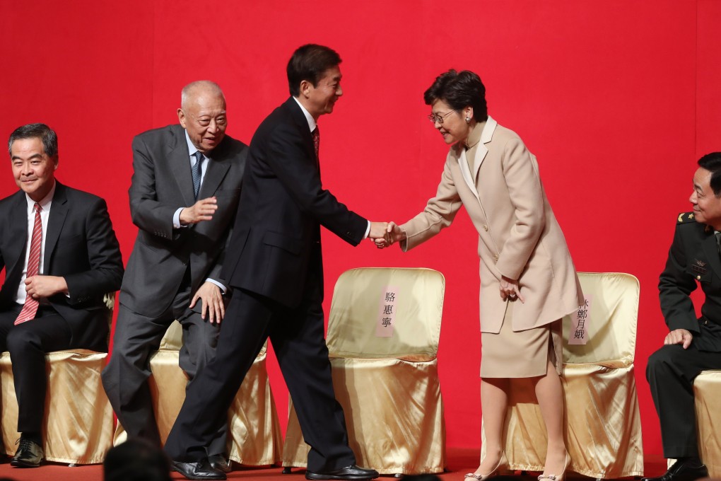 Luo Huining, director of Beijing’s liaison office, shakes hands with Chief Executive Carrie Lam, at the liaison office spring reception, at the Hong Kong Convention and Exhibition Centre on January 15. Photo: Sam Tsang