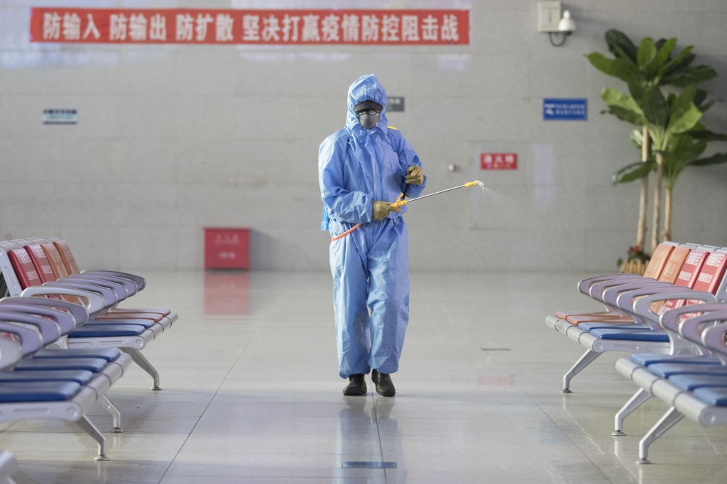 A worker disinfects a waiting hall at the Suifenhe railway station in Heilongjiang on Thursday, as officials try to control the coronavirus. Photo: Xinhua