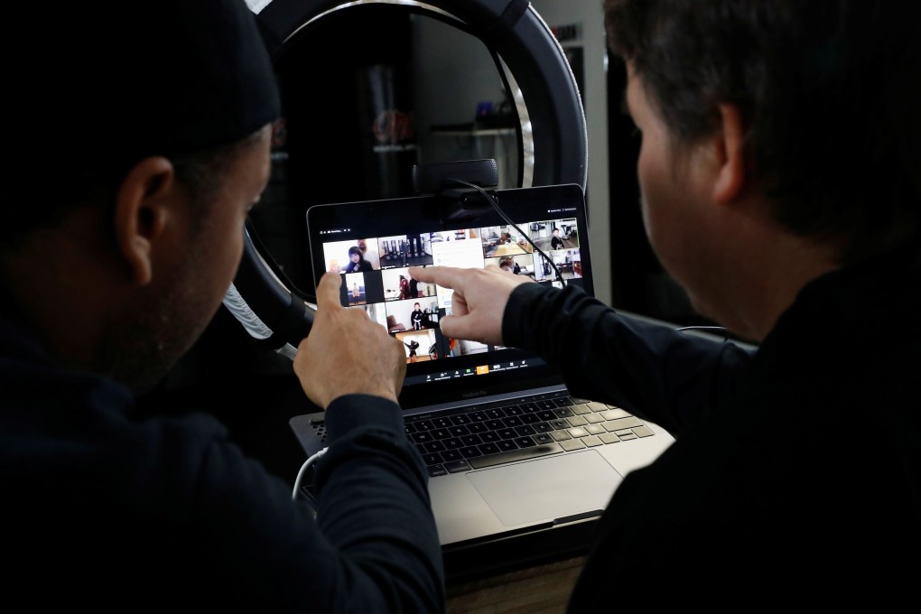 Teachers at a California martial arts school organise students ahead of a virtual lesson over Zoom, on March 23. Photo: Reuters