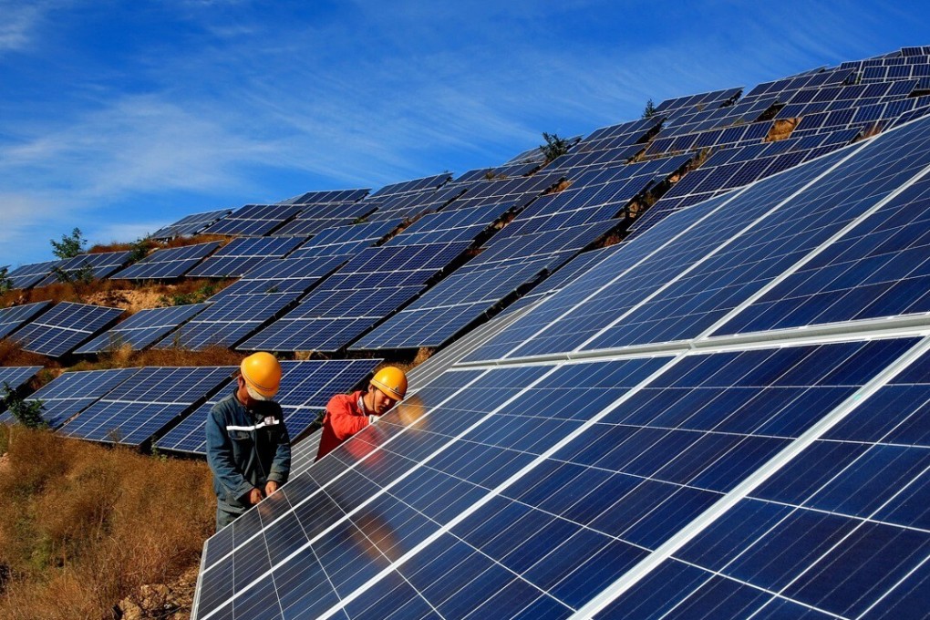 Workers construct a solar power field in Qinhuangdao located in northern Hebei province in China. Photo: Xinhua