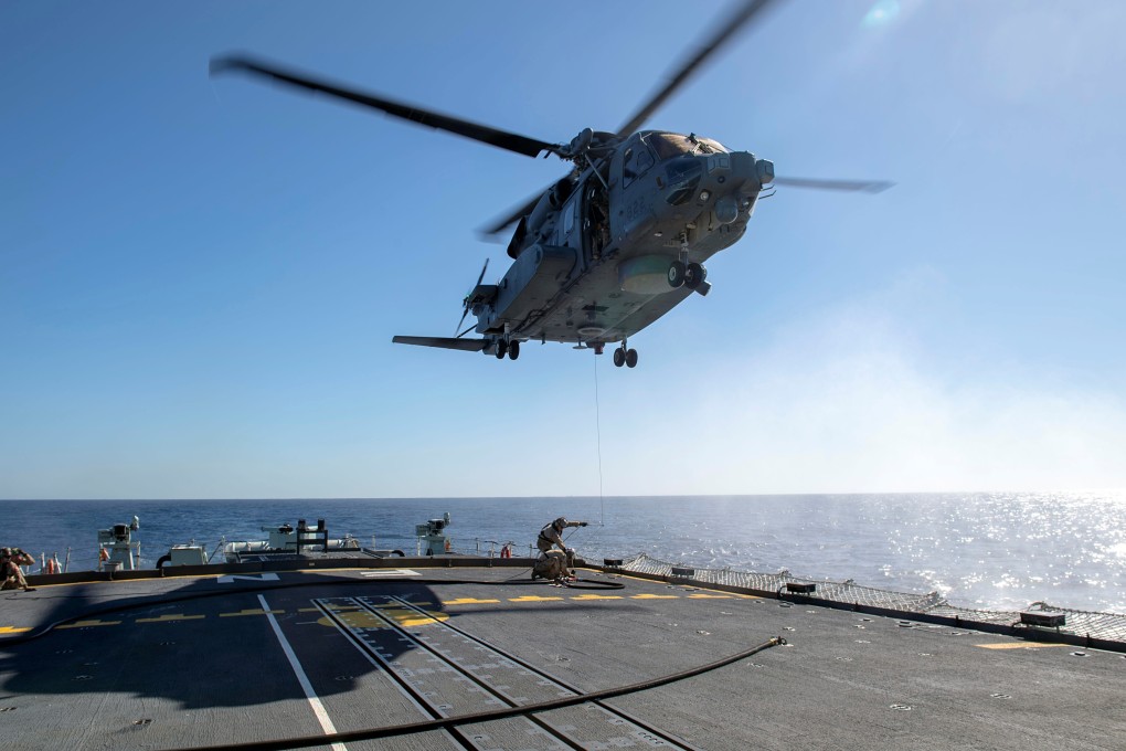 A CH-148 Cyclone helicopter hovers above the HMCS Fredericton in February. Photo: Corporal Simon Arcand/Canadian Armed Forces via Reuters