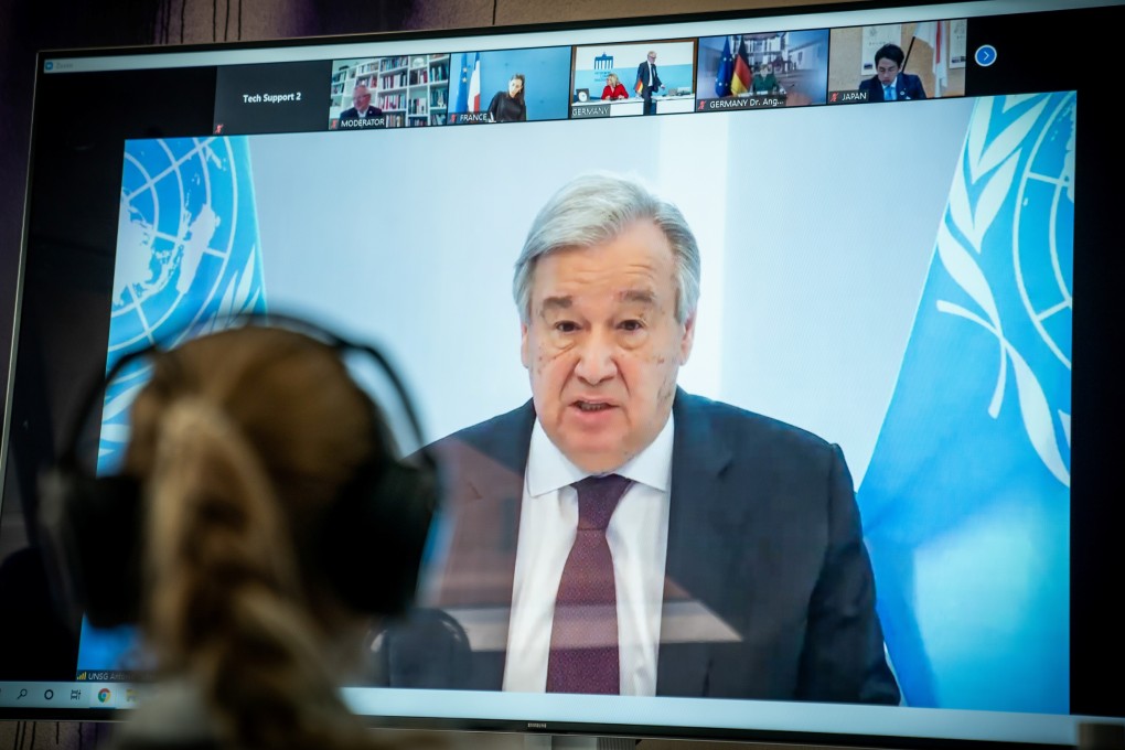 United Nations Secretary-General Antonio Guterres is seen on a video screen during a virtual climate summit in Berlin on Tuesday. Photo: Reuters