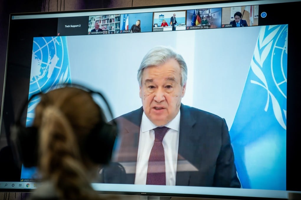United Nations Secretary-General Antonio Guterres is seen on a video screen during a virtual climate summit in Berlin on Tuesday. Photo: Reuters