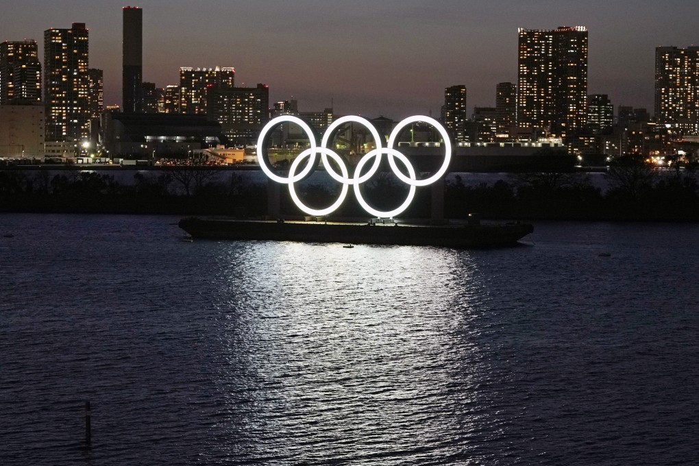A giant Olympic rings monument is illuminated at dusk at Odaiba Marine Park in Tokyo, Japan, on March 25, 2020. Photo: EPA
