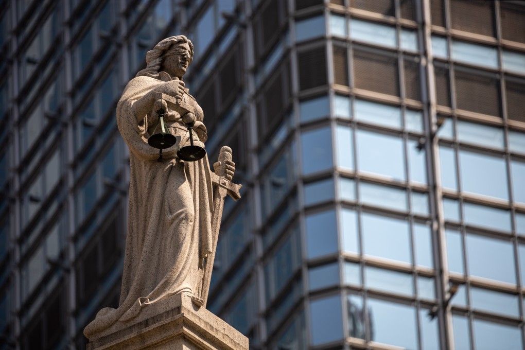 A statue of Lady Justice sits on top of the Court of Final Appeal in Central district. Hong Kong’s rule of law has been eroding since the handover, and now we might be looking at the end of it. Photo: EPA-EFE