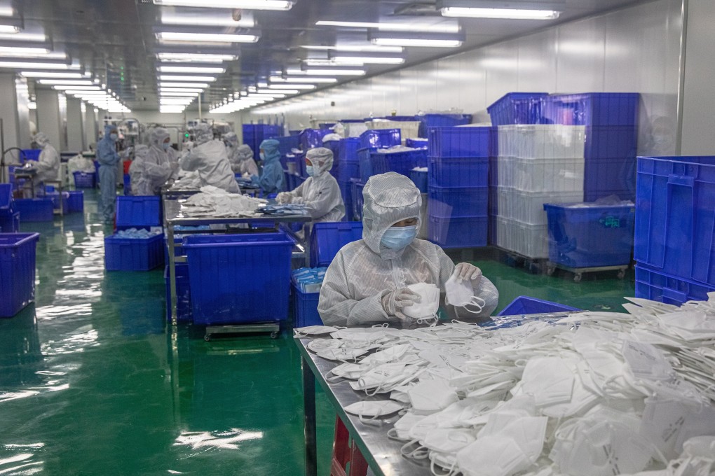 Employees in protective gear sort face masks at Zonsen Medical Products factory in Wuhan on April 12. In light of the coronavirus pandemic, governments are likely to pay more attention to medical supplies, deploying industrial policies to reduce dependence on imports and ensure sufficient domestic capacity in case of another outbreak. Photo: EPA-EFE