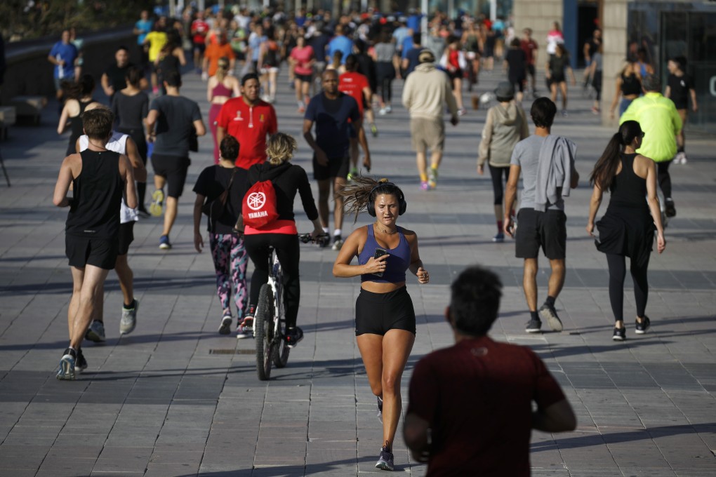 People exercise on a seafront promenade in Barcelona, Spain. Photo: AP