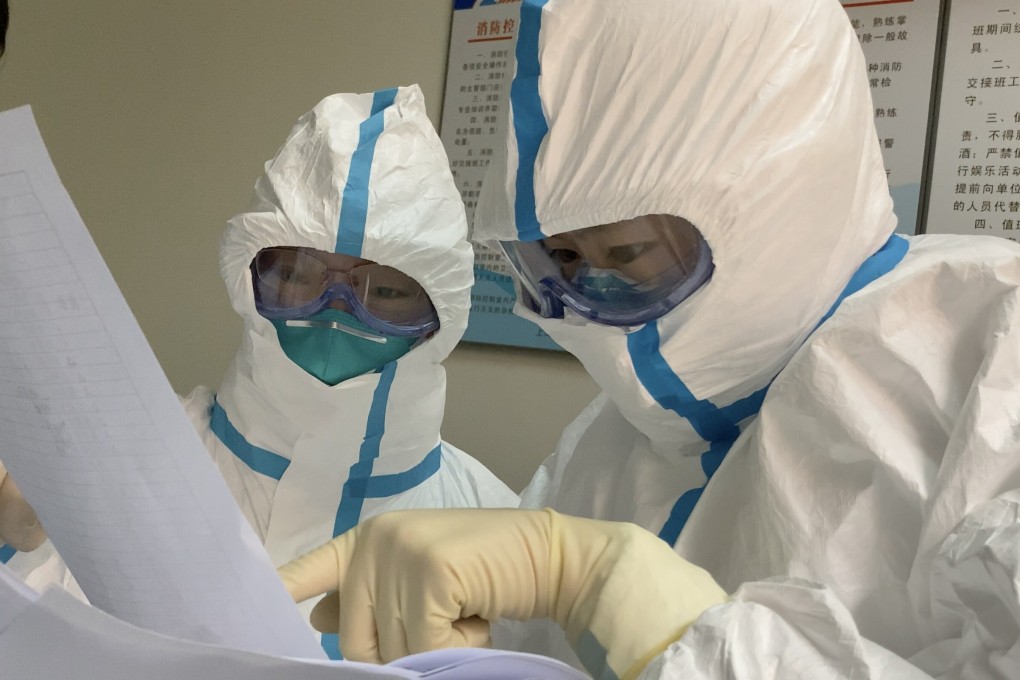 Shanghai epidemiology surveyor Gong Xiaohuan (right) uses detective work to trace the spread of infection. Photo: Shanghai CDC